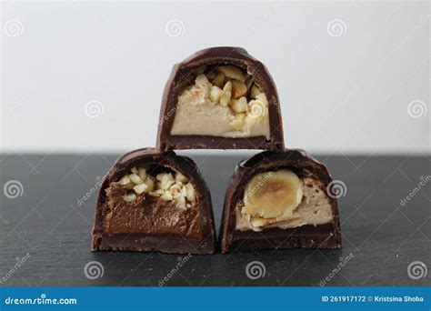 Three Chocolate Glazed Case Candies With Praline Chocolate Filling And