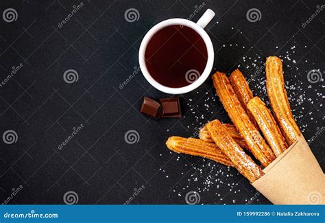 Churros With Sugar And Chocolate Sauce On Black Background Top View