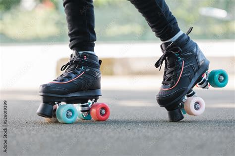 Crop child walking in roller skates Stock-Foto | Adobe Stock