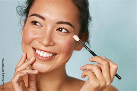 Beauty Woman Applying Makeup On Eyes With Cosmetic Brush Closeup