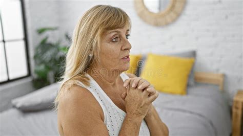 Middle Aged Woman A Beautiful Blonde Praying With Faith And Hope