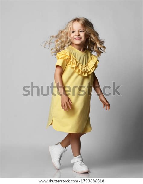 Стоковая фотография 1793686318 Happy Smiling Cute Blonde Curly Kid