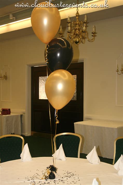 Pin On Holiday Party Black And Gold Centerpieces 50th Birthday Table