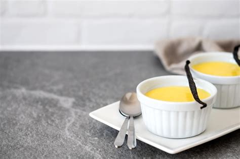 Premium Photo Homemade Vanilla Custard On Wooden Table Background