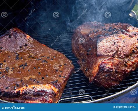 Beef brisket in the smoker stock photo. Image of protein - 223652300