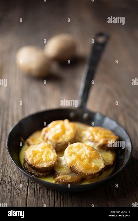 Rustic Spanish Fried Potatoes Patatas Bravas With Cheese Stock Photo