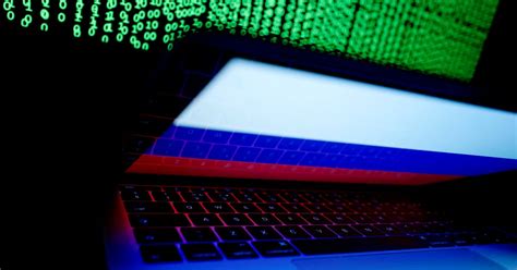 How is Russia conducting cyber and information warfare in Ukraine?