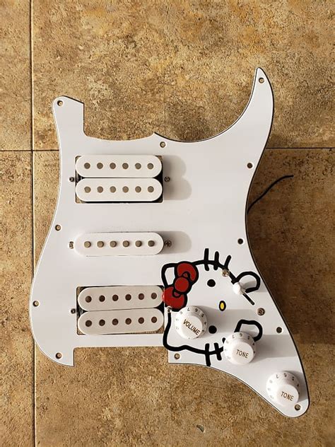 Squier Loaded Strat Pickguard Hello Kitty Reverb