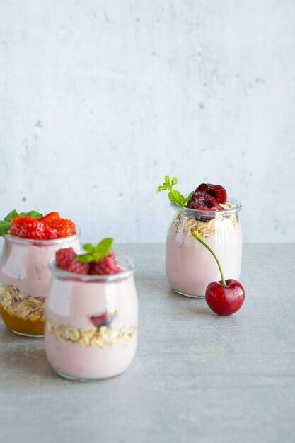 Premium Photo | Yogurt with granola and berries.