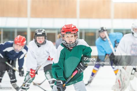 Kids Playing Hockey Together Stock Photo - Download Image Now - Child ...