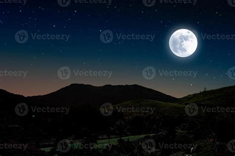 Starry night over mountain with full moon. 11869687 Stock Photo at Vecteezy