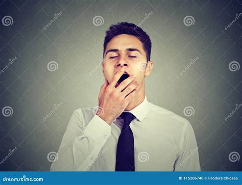 Sleepy Man Yawning With Hand Over Mouth Stock Photo Image Of Deprived