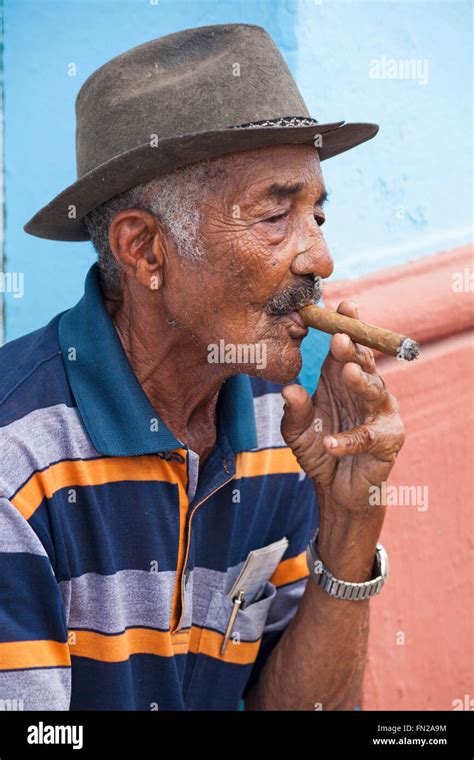 Daily Life In Cuba Cuban Man Smoking Cigar At Trinidad Cuba West