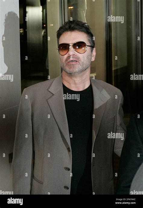 British Singer George Michael Leaves An Exhibition Of Photographs By Late Linda Mccartney In A