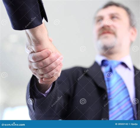 Business People Shaking Hands Over A Deal Stock Photo Image Of