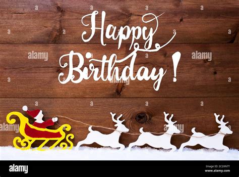 English Calligraphy Happy Birthday. Santa Claus With Sleigh And Reindeers. Wooden Background ...