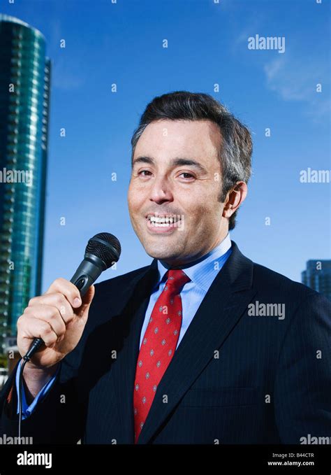 Hispanic Male Reporter Holding Microphone Stock Photo Alamy