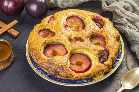 Premium Photo Traditional Rustic Plum Cake On A Dark Background