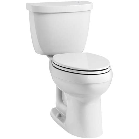 A White Toilet With The Lid Up And No Tank Cover On In Front Of A