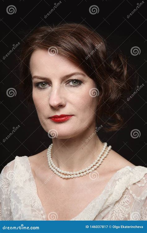 Vintage Style Portrait Of Beautiful Mature Woman With Red Lipstick