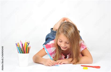 Little girl lying on floor and drawing, isolated on white Stock Photo ...