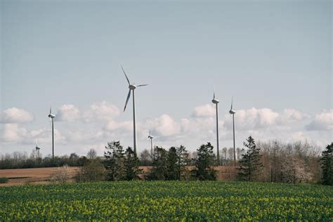 Premium Photo Wind Turbines Landscape Breathtaking Landscape Of Wind Turbines Symbolizing