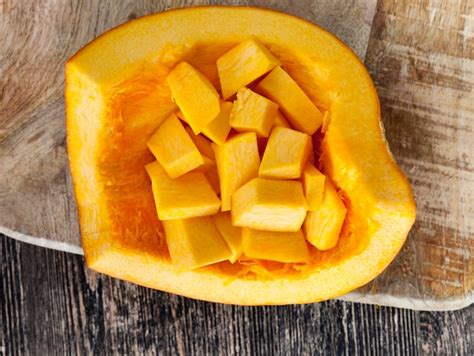 Premium Photo Cut Into Cubic Pieces Of Ripe Yellow Pumpkin Pulp While