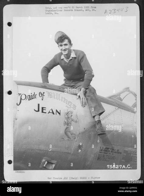 A Ground Crew Member Of The 94th Fighter Squadron 1st Fighter Group Seated On The Nose Of His