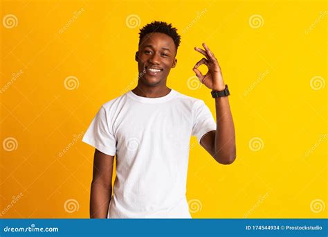 African Guy Showing Ok Sign And Widely Smiling Stock Photo Image Of