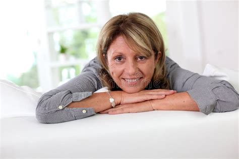 Mature Woman Relaxing On Sofa Stock Photo Image Of Sitting Pensioner
