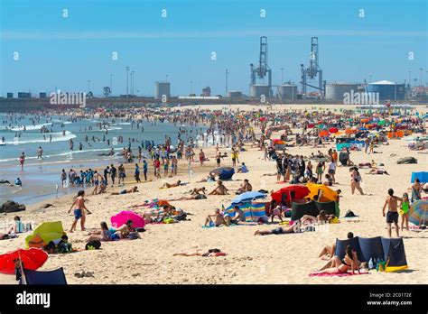 Porto Portugal June People Sunbathing On Matosinhos Beach By