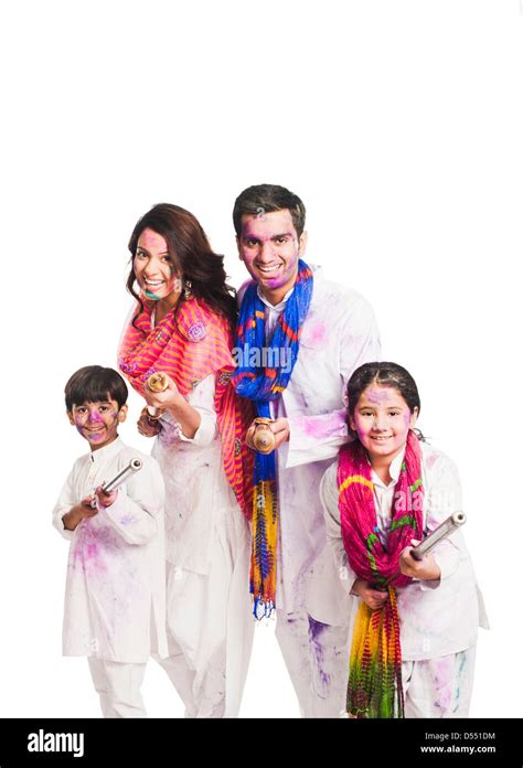 Family celebrating Holi festival Stock Photo - Alamy