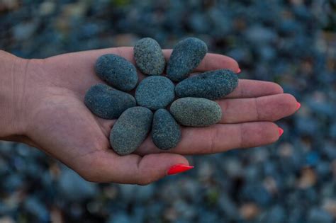 Premium Photo Cropped Hand Holding Stones