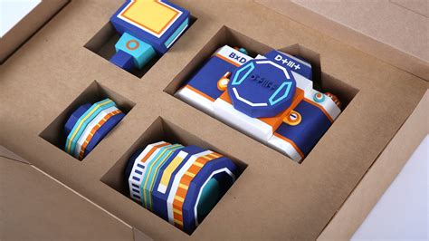 A Paper Camera Comprised of Complementary Colors Includes ...