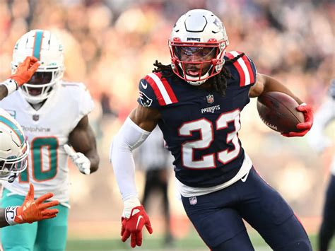 Download Patriots Player Running With Football Wallpaper
