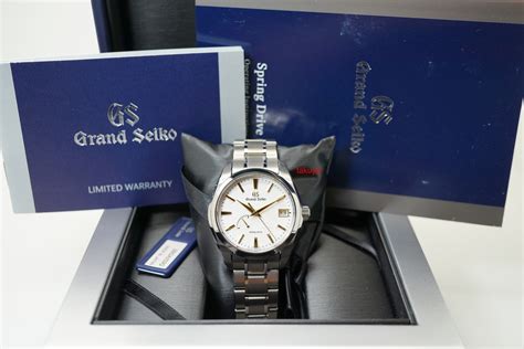 Brand New Grand Seiko Golden Snowflake Spring Drive Titanium Sbga259