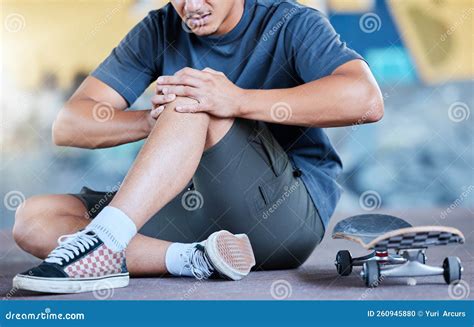 Man Skateboard And Knee Injury In Street City Or Outdoors After Stunt