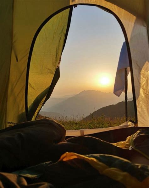 The View From Inside A Tent At Sunset