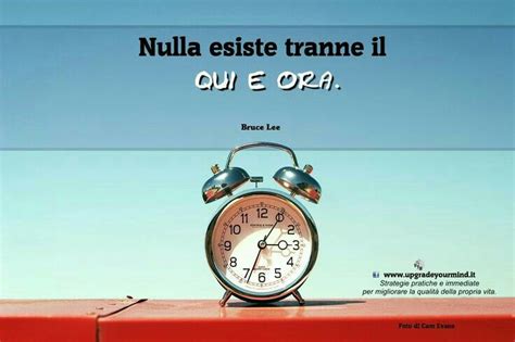 An Alarm Clock Sitting On Top Of A Red Box With The Words Nulla Assiste