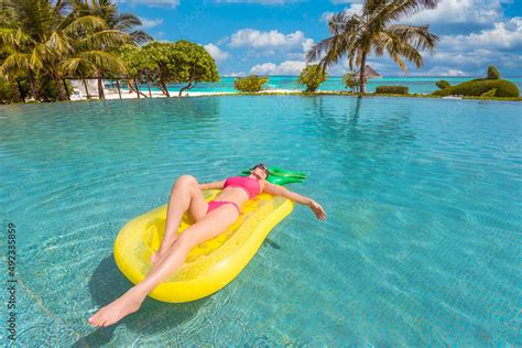 Beautiful Sexy Woman Relaxing On Rubber Inflatable Swimming Pool