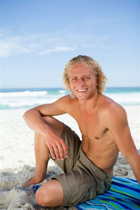 Smiling Man Sitting On His Beach Towel Stock Image Image Of Sitting