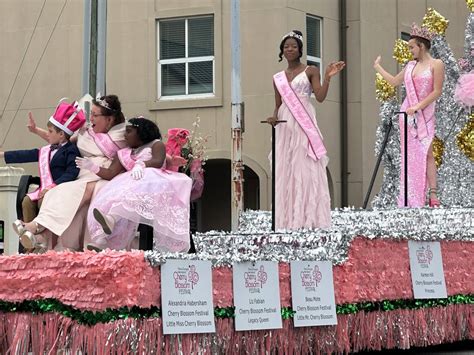 Visitors Locals Enjoy The Parade And Carnival At Macons Cherry