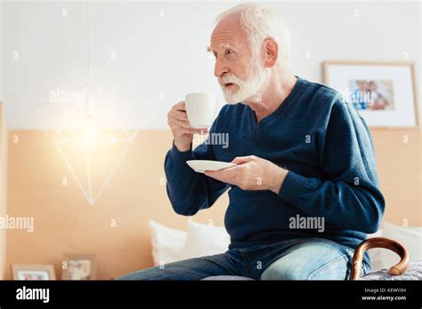 Concentrated Retirement Drinking His Morning Coffee Stock Photo Alamy