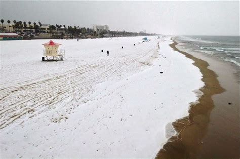 Rare snow on Huntington Beach plus waterspouts near Los Angeles — Earth Changes — Sott.net