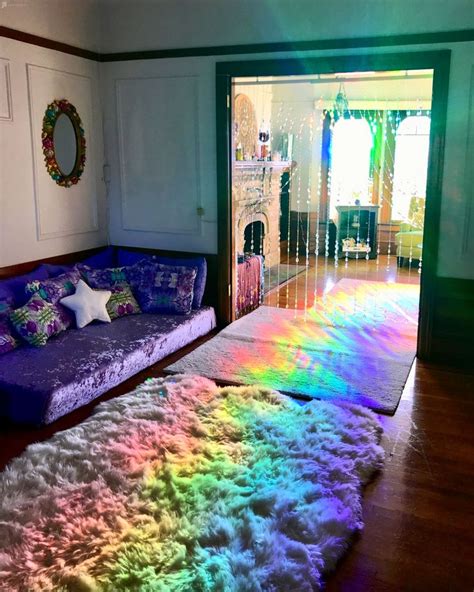 A Living Room Filled With Furniture And Rainbow Rugs