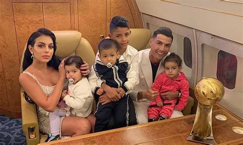Cristiano Ronaldo poses with another trophy alongside girlfriend and ...