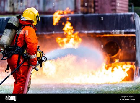 Firefighters spraying down fire flame from oil tanker truck accident ...