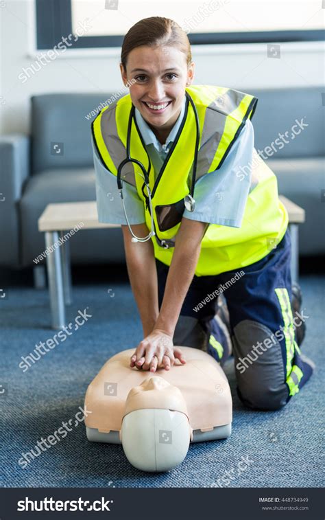 Female Paramedic During Cardiopulmonary Resuscitation Training Stock