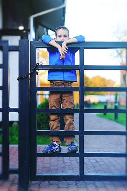 70 People Peering Over Fence Stock Photos Pictures And Royalty Free