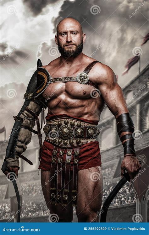 Roman Gladiator With Swords Posing In Ancient Coliseum Stock Image